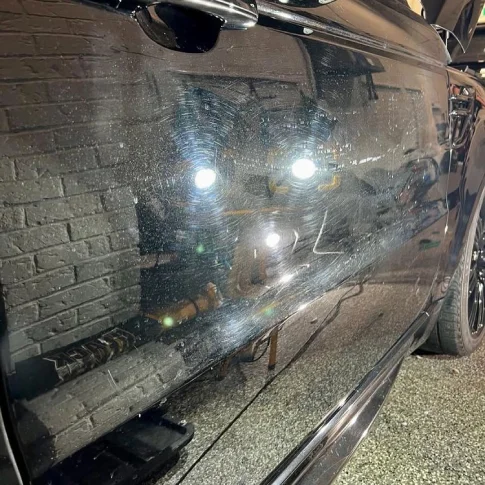 Close-up of light swirl marks and scratches before correction in Mississauga.