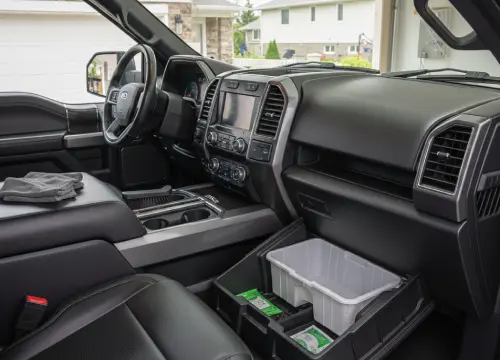 Detailer cleaning tight crevices and storage compartments.
