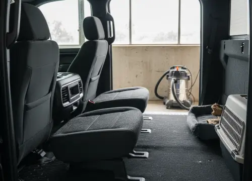 Truck cab with dense pet hair before professional removal.