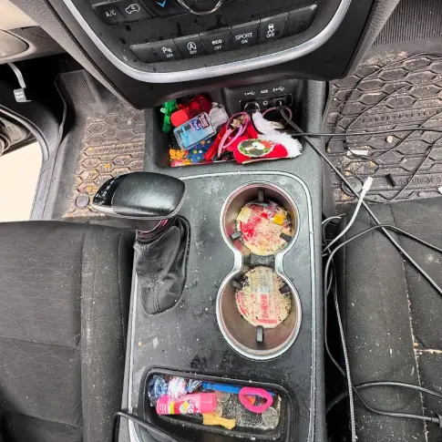 Before: mobile car detailing at home, interior cluttered and stained
