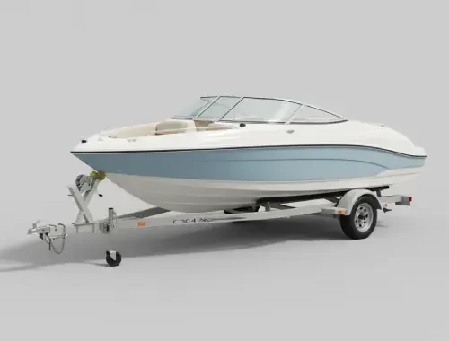 Boat on a trailer receiving surface cleaning and rinsing with marine-safe products.