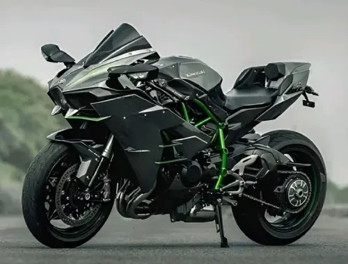 Technician hand-cleaning a motorcycle and chrome finishes.