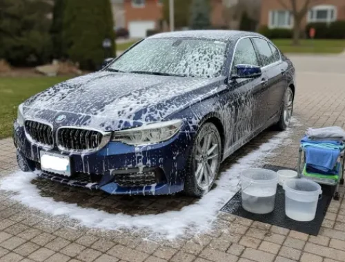 Snow foam hand wash using the two-bucket method for safe cleaning