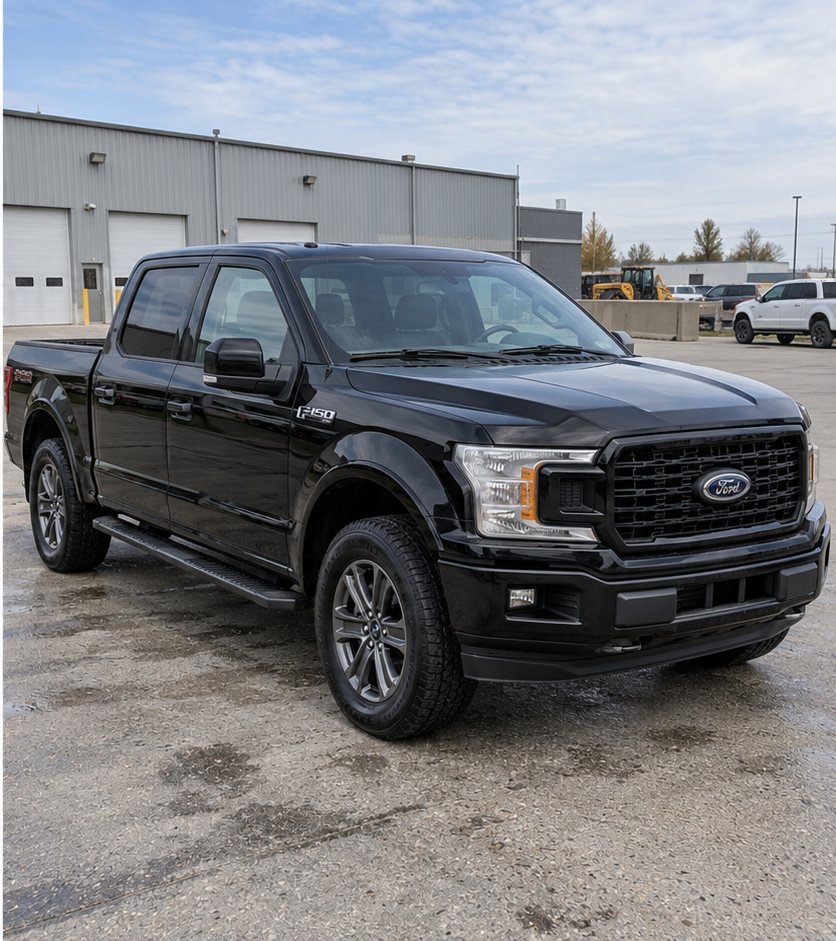 The same black Ford F-150 pickup truck front end washed to a clean, glossy black finish