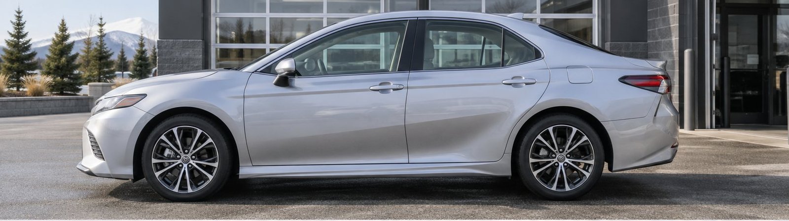 Silver sedan side profile with clear, untinted side windows